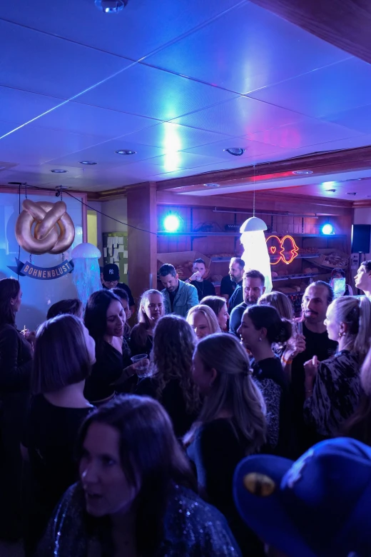 Crowd dancing in blue light at the LAGOOON Bakery Rave
